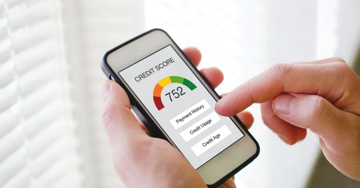 Person checking a credit score of 752 on a smartphone app